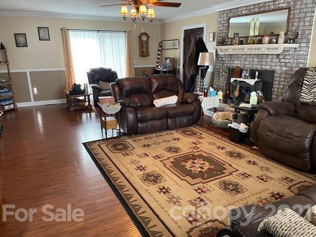 845 Sandy Level Church Road Bostic, NC 28018 - Photo 9 of 46 a living room with furniture and a fireplace
