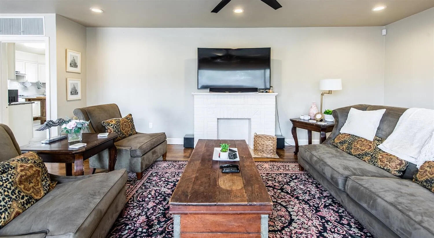 3105 29th Street Lubbock, TX 79410 - Photo 2 of 18 a living room with furniture and a flat screen tv