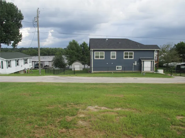 a view of outdoor space with a garden and trees