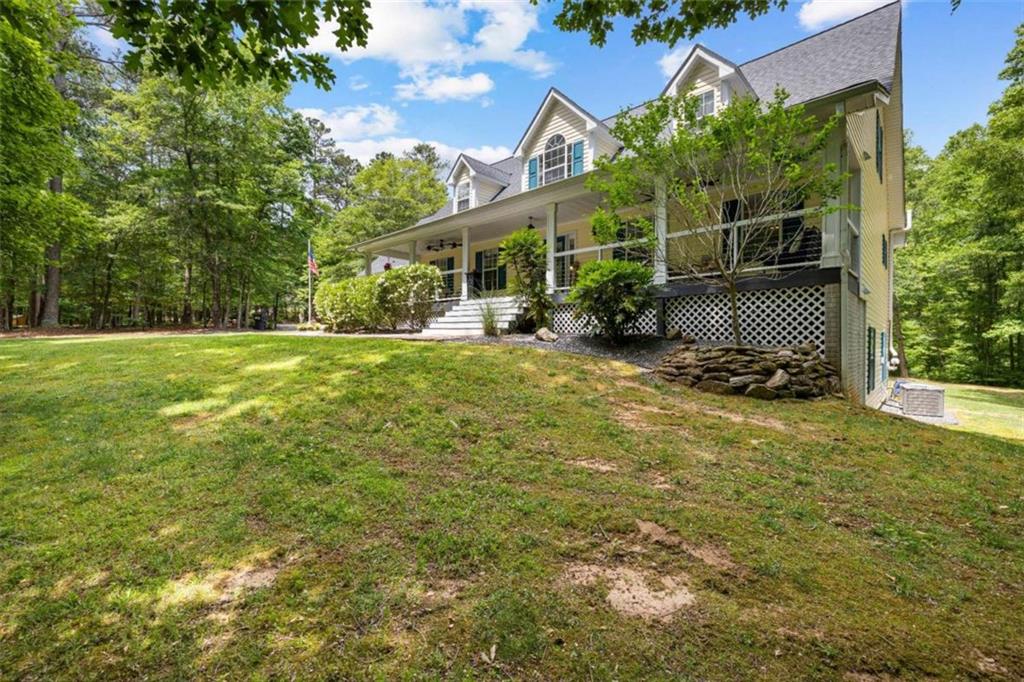 128 Byrom Road Senoia, GA 30276 - Photo 4 of 83 a view of a house with a yard and sitting area