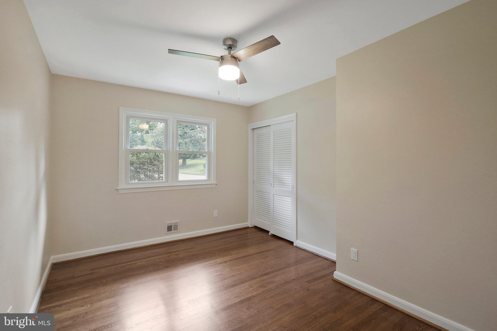 2342 Barbour Road Falls Church, VA 22043 - Photo 11 of 30 wooden floor in an empty room with a window