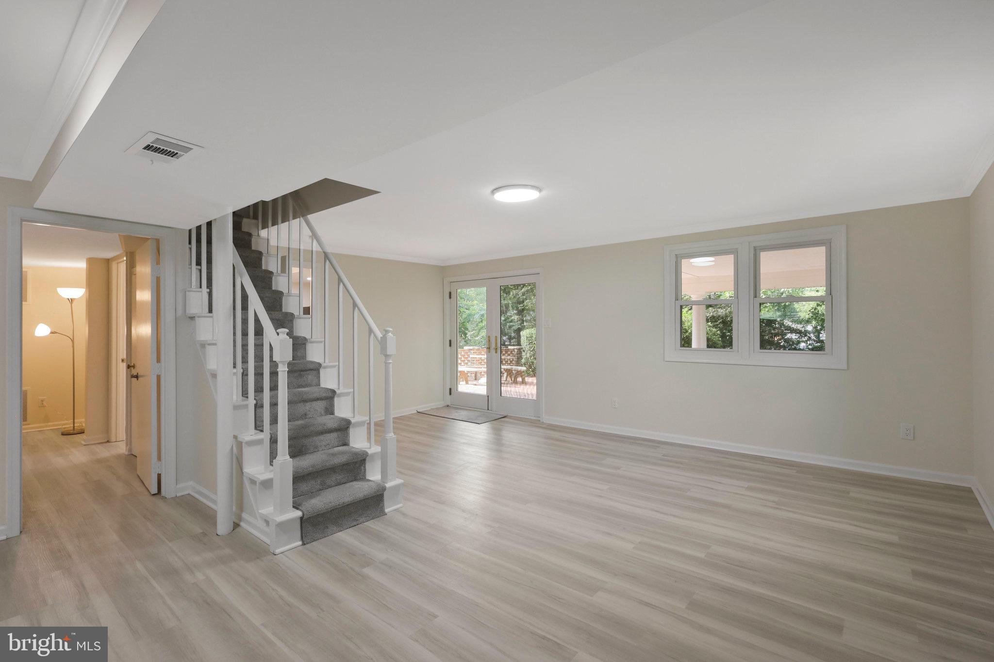 2342 Barbour Road Falls Church, VA 22043 - Photo 14 of 30 a view of an empty room with wooden floor and a window