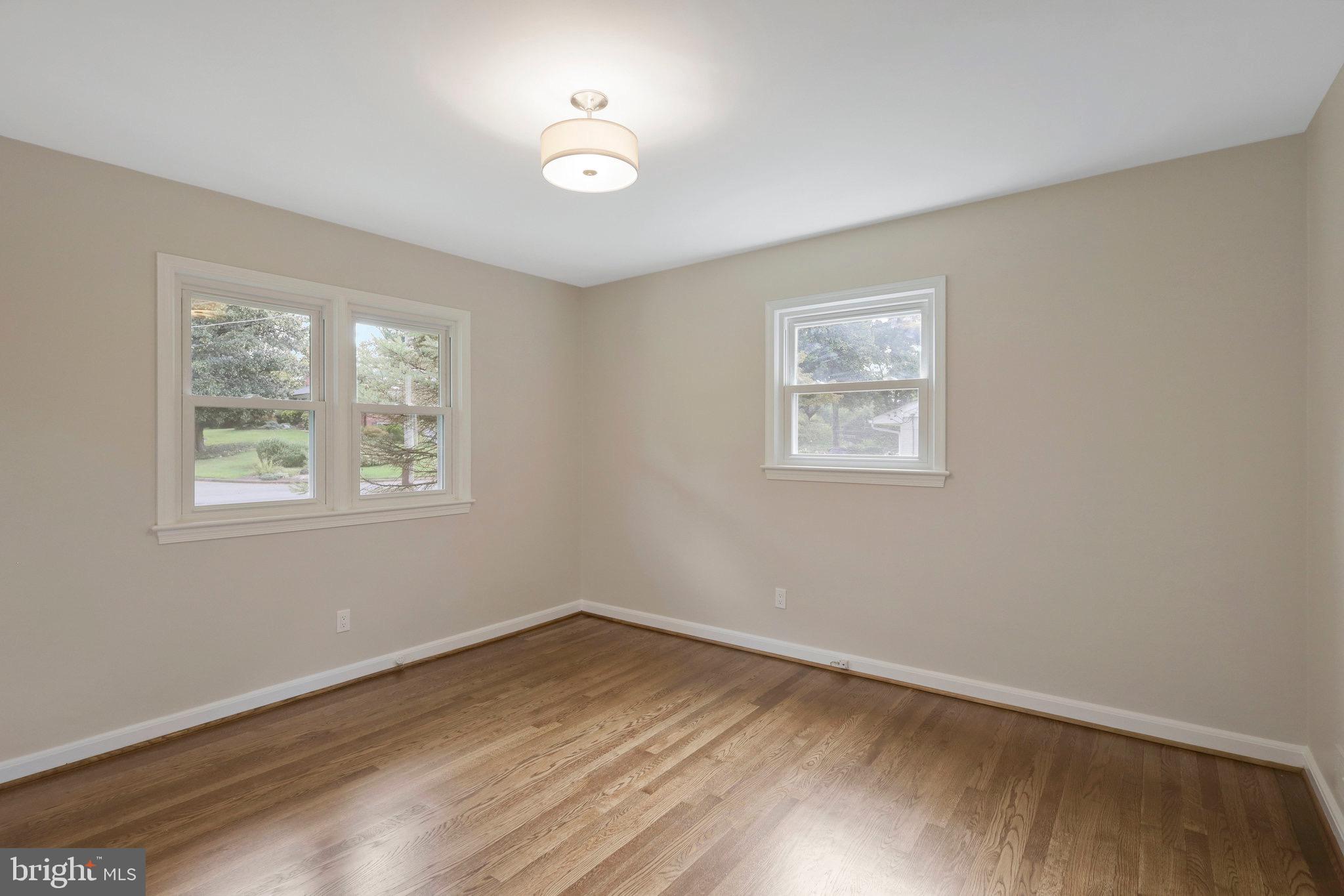 2342 Barbour Road Falls Church, VA 22043 - Photo 10 of 30 wooden floor in an empty room with a window