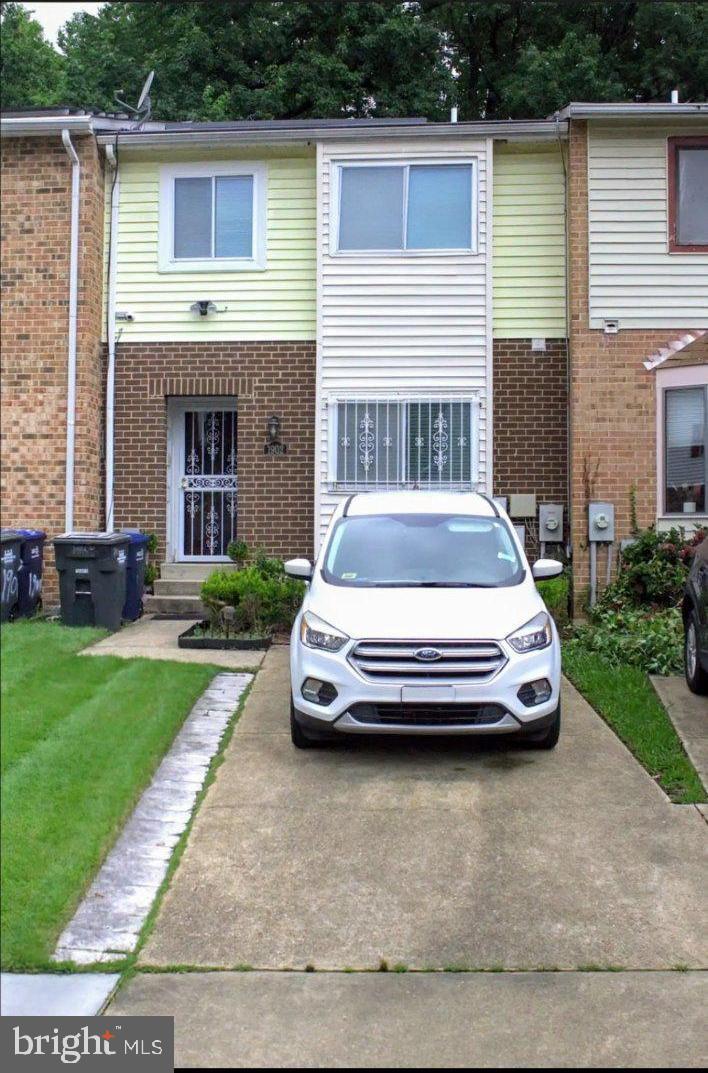 a car parked in front of a house