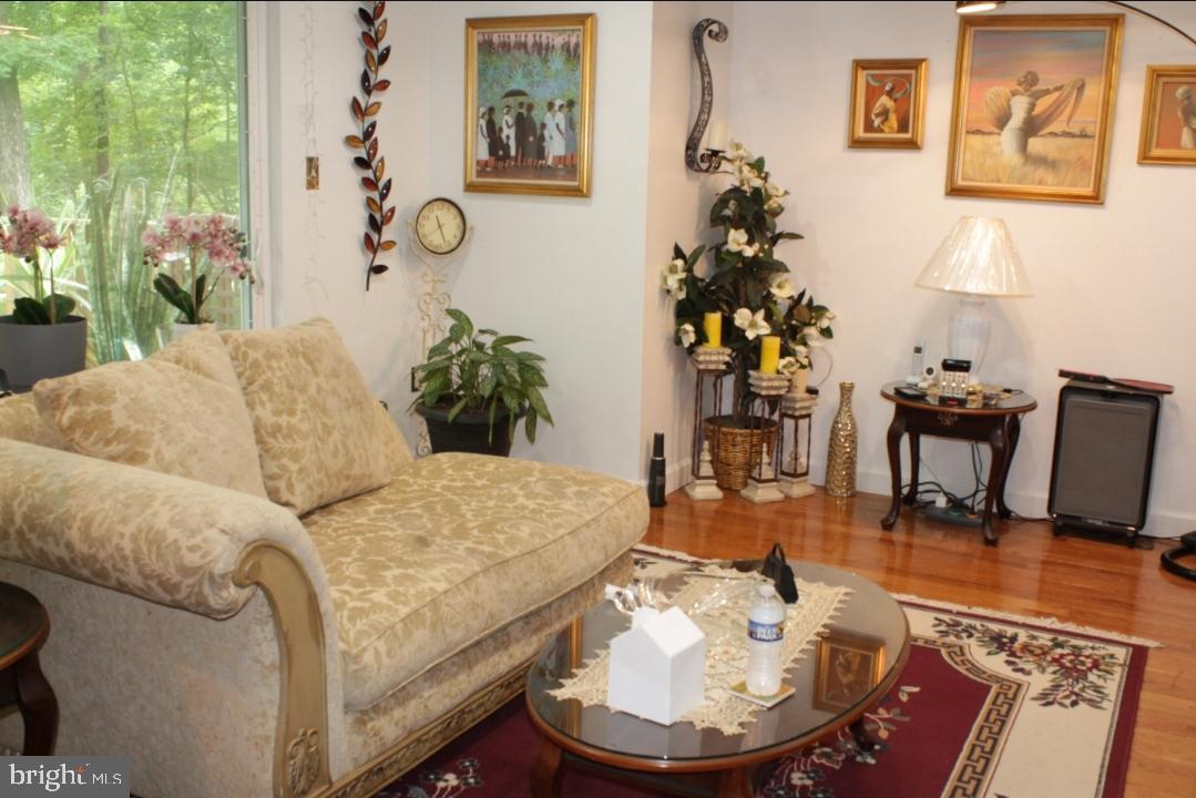 1902 Valley Terrace Southeast Washington, DC 20032 - Photo 11 of 38 a living room with furniture and wooden floor