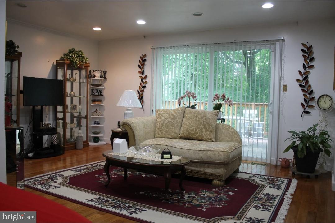 1902 Valley Terrace Southeast Washington, DC 20032 - Photo 12 of 38 a living room with furniture and a rug