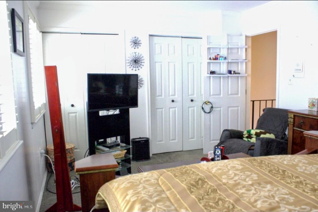 1902 Valley Terrace Southeast Washington, DC 20032 - Photo 20 of 38 a bedroom with a bed furniture and a flat tv screen