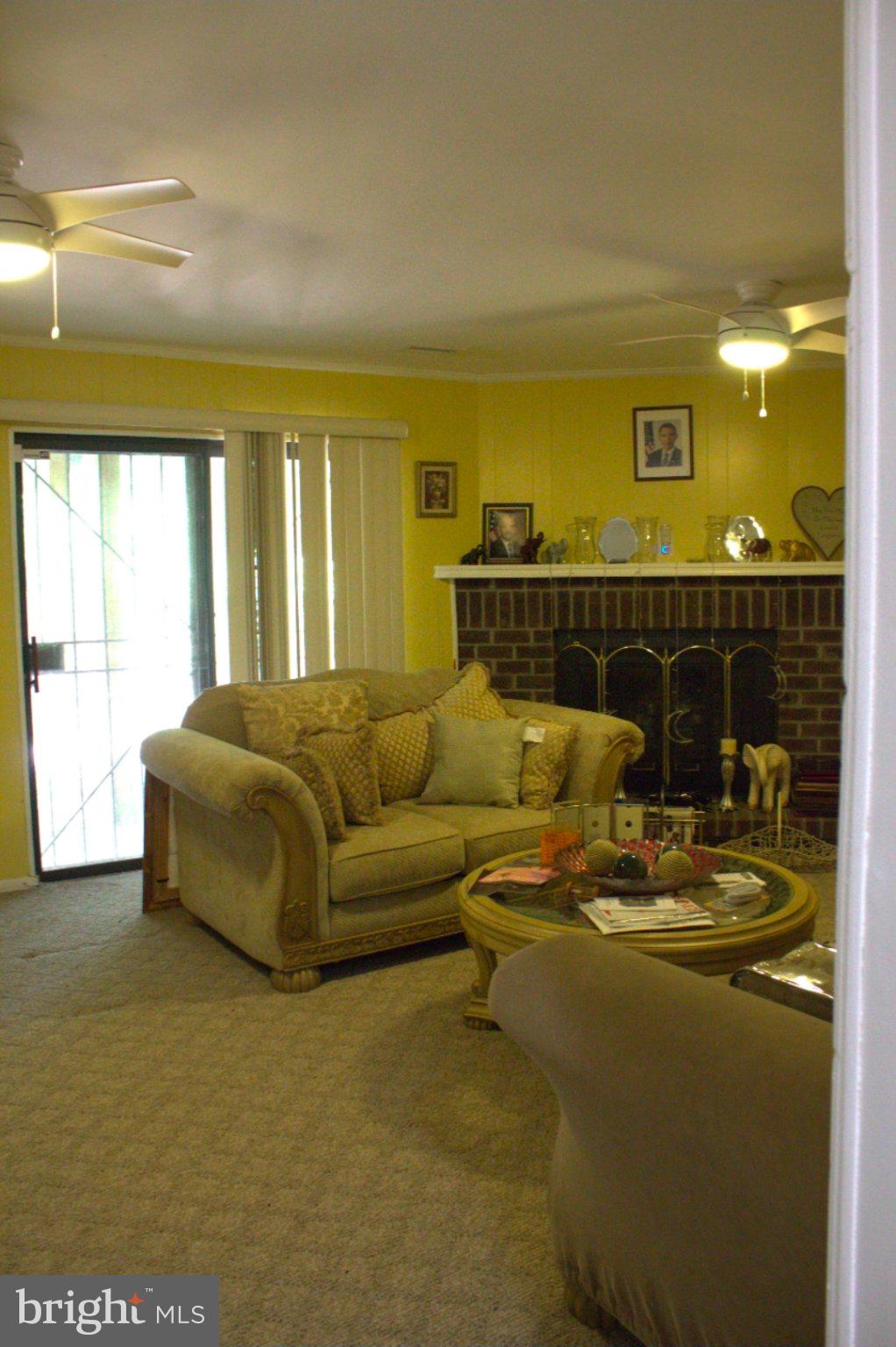 1902 Valley Terrace Southeast Washington, DC 20032 - Photo 28 of 38 a living room with a couch and chandelier