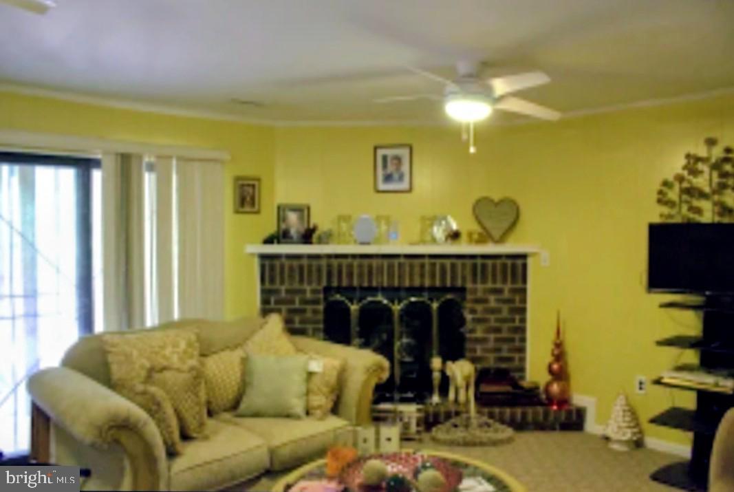 1902 Valley Terrace Southeast Washington, DC 20032 - Photo 30 of 38 a living room with furniture and a flat screen tv
