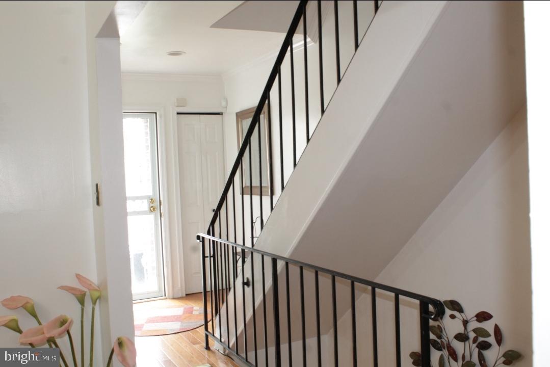 1902 Valley Terrace Southeast Washington, DC 20032 - Photo 3 of 38 a view of staircase with railing and white walls