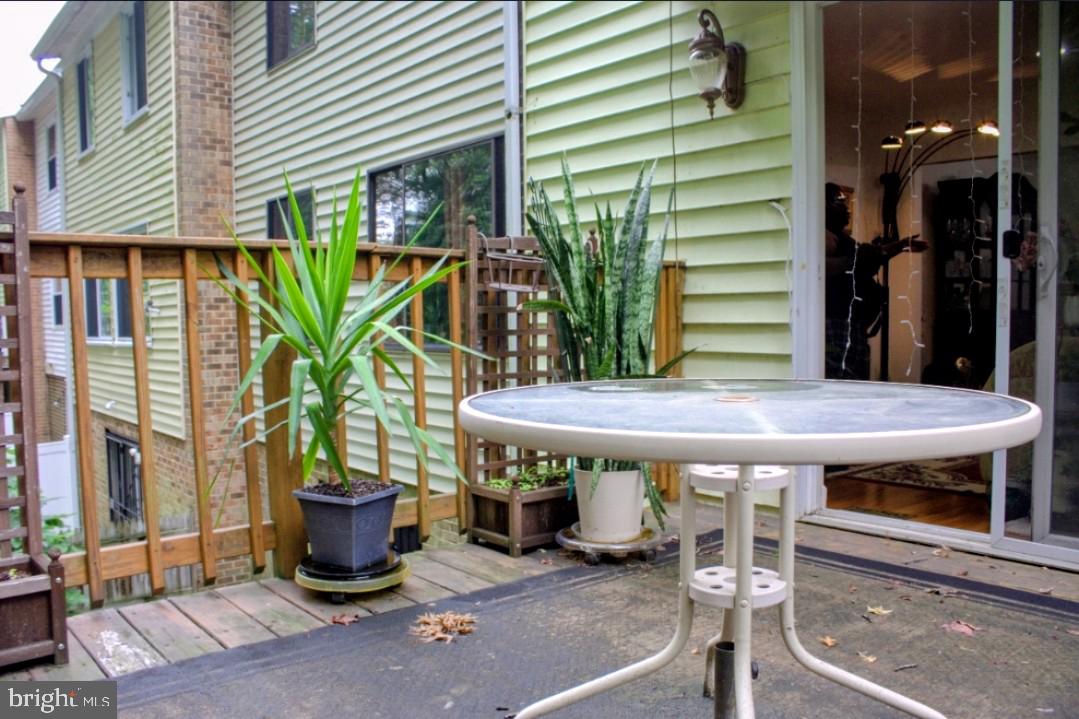 1902 Valley Terrace Southeast Washington, DC 20032 - Photo 31 of 38 a view of a patio with table and chairs potted plants