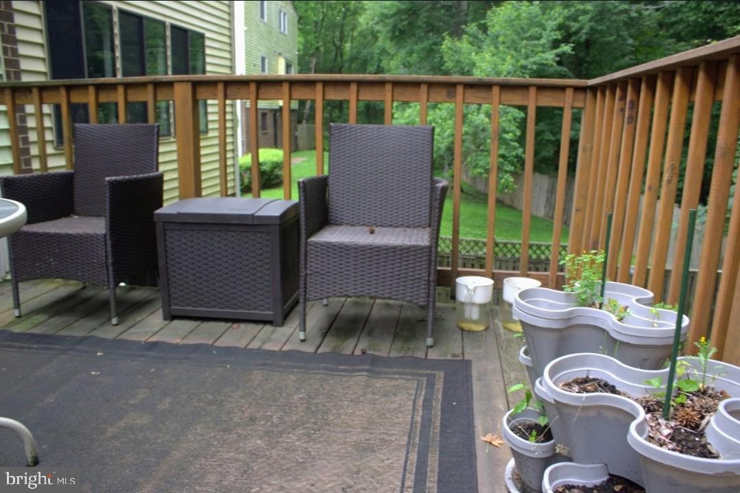 1902 Valley Terrace Southeast Washington, DC 20032 - Photo 33 of 38 a view of a patio with couches chairs and potted plants