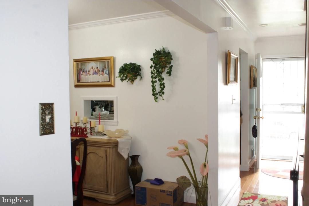 1902 Valley Terrace Southeast Washington, DC 20032 - Photo 7 of 38 a view of a workspace with furniture and a window