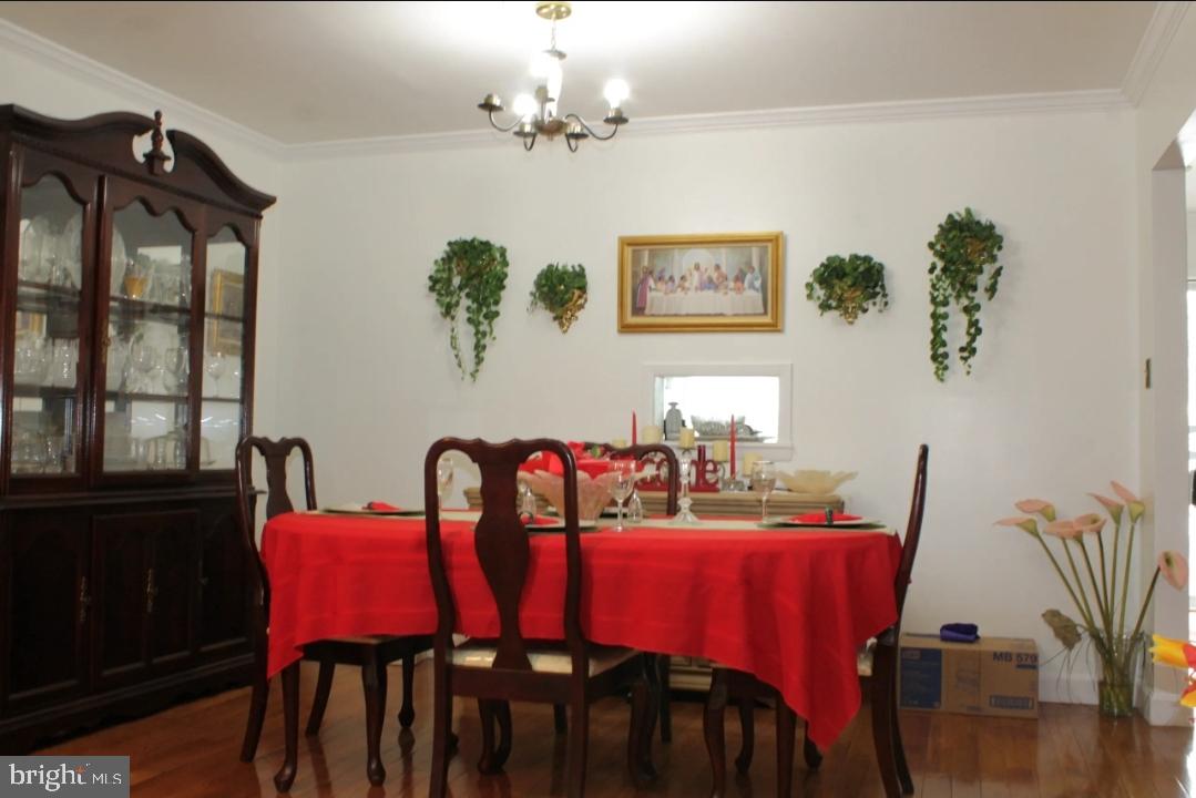 1902 Valley Terrace Southeast Washington, DC 20032 - Photo 9 of 38 a view of a dining room with furniture and wooden floor