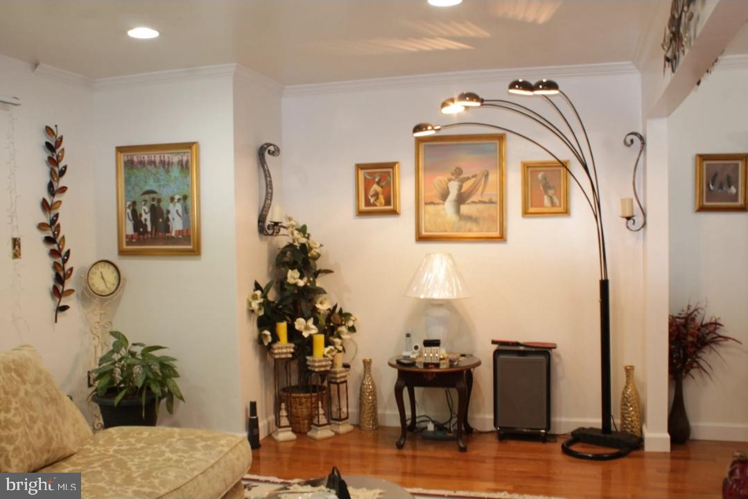 1902 Valley Terrace Southeast Washington, DC 20032 - Photo 10 of 38 a living room with furniture and wooden floor