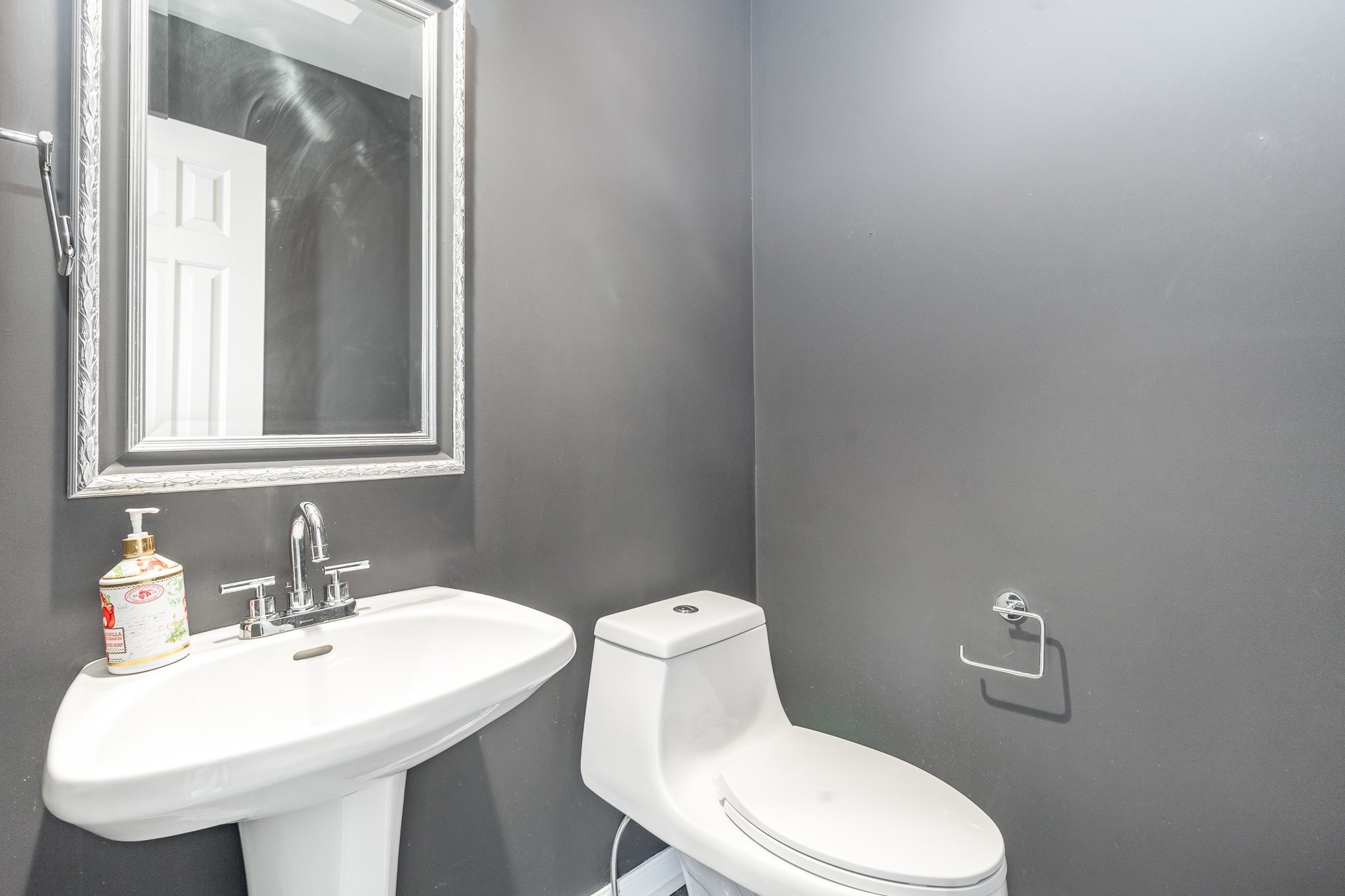 3014 Bent Tree Road Franklin, TN 37067 - Photo 8 of 17 a white toilet sitting next to a bathroom sink