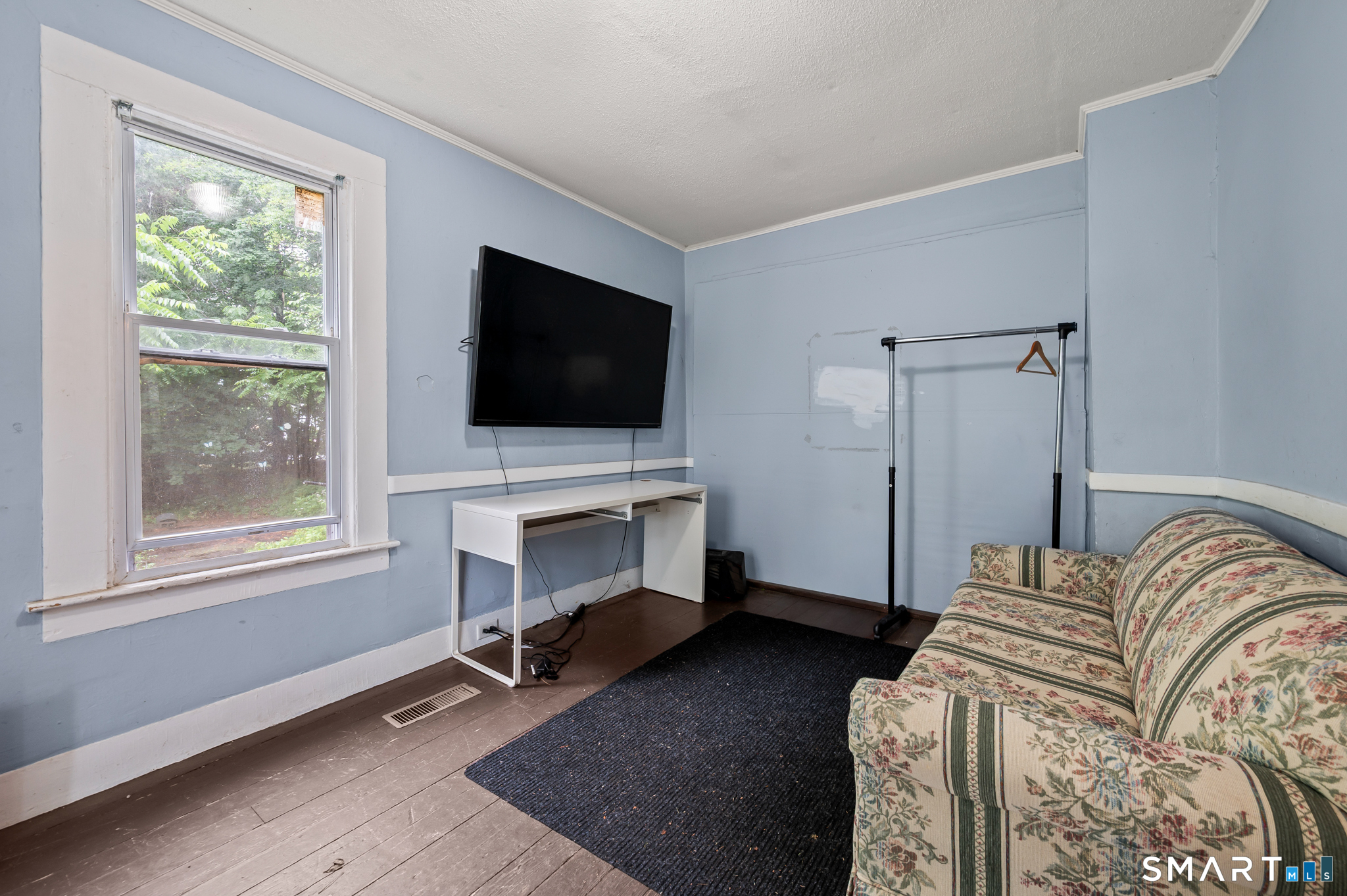 220 Murray Street Meriden, CT 06450 - Photo 10 of 28 a bedroom with a bed and a flat screen tv