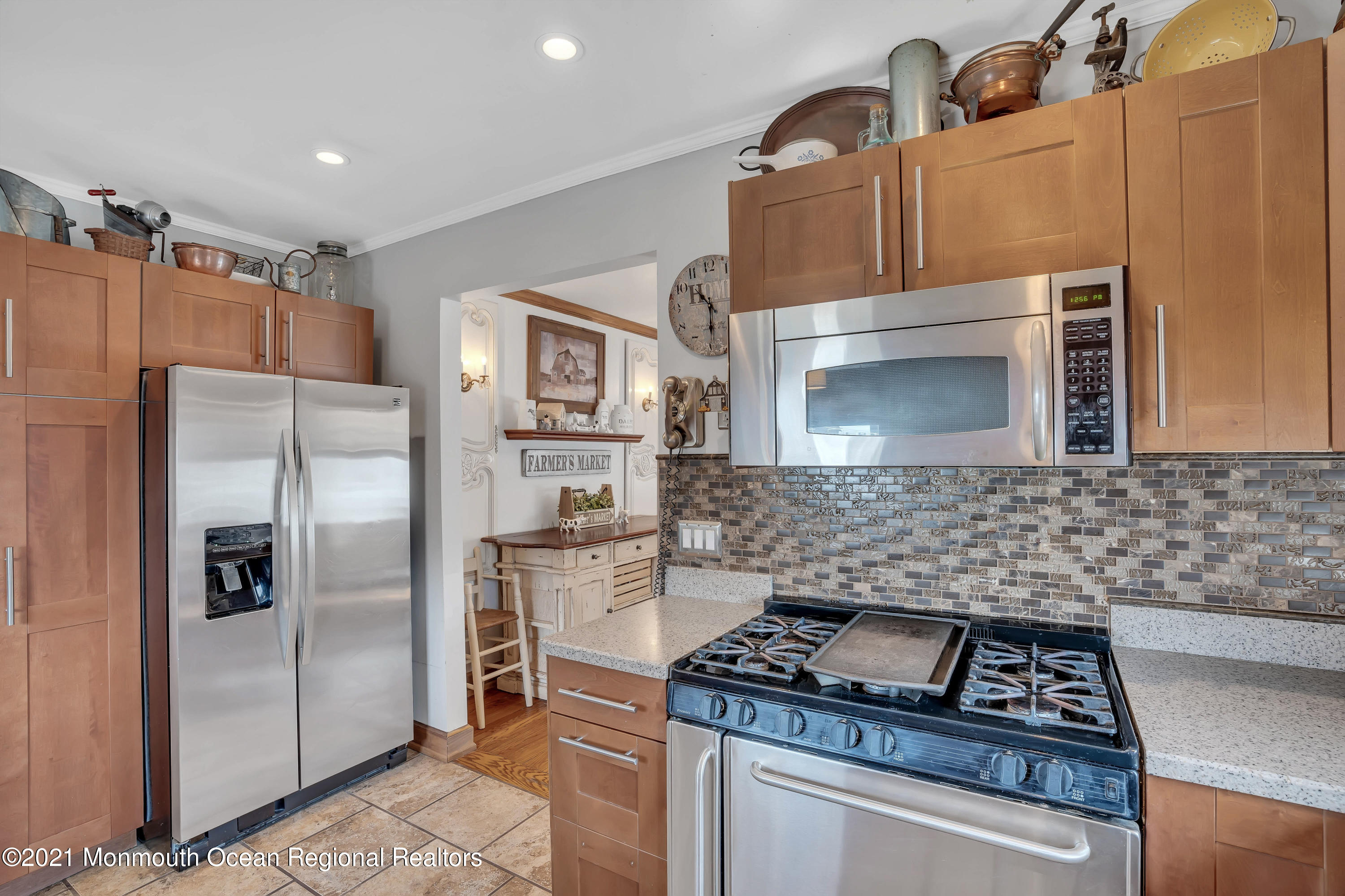 212 Oakhurst Road Oakhurst, NJ 07755 - Photo 13 of 35 a kitchen with stainless steel appliances granite countertop a refrigerator a stove and a sink with wooden floor