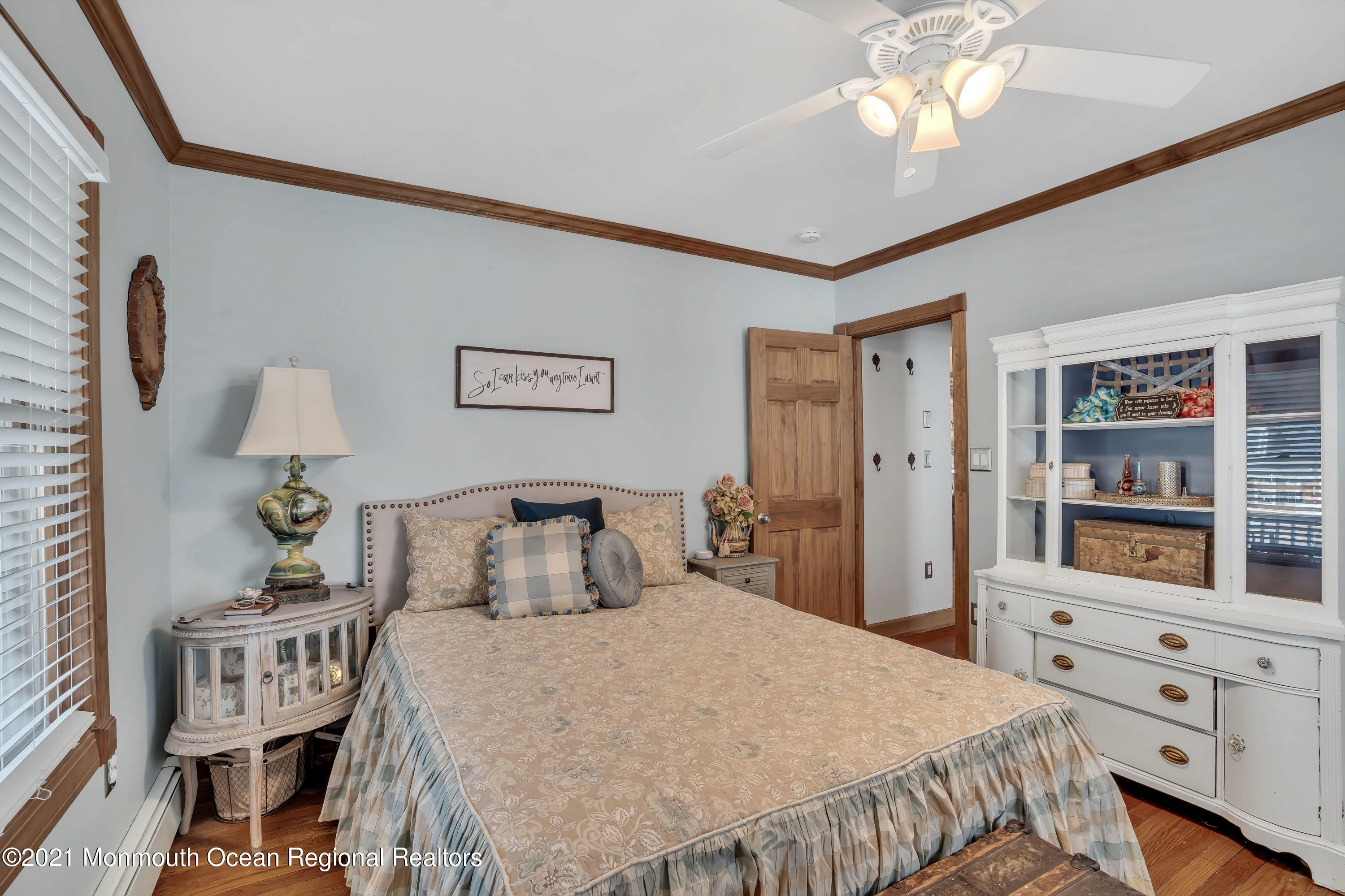 212 Oakhurst Road Oakhurst, NJ 07755 - Photo 15 of 35 a bedroom with a bed and a chandelier
