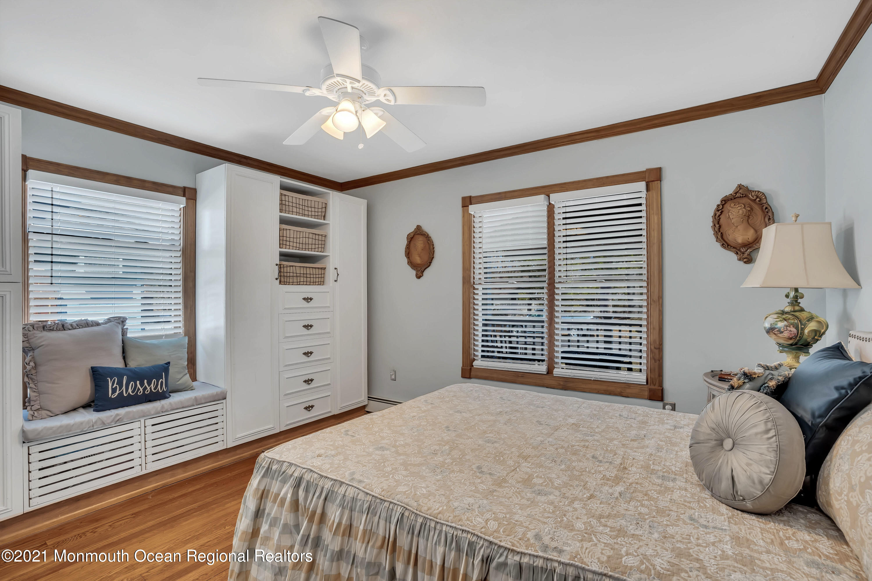 212 Oakhurst Road Oakhurst, NJ 07755 - Photo 16 of 35 a bedroom with a bed and a chandelier