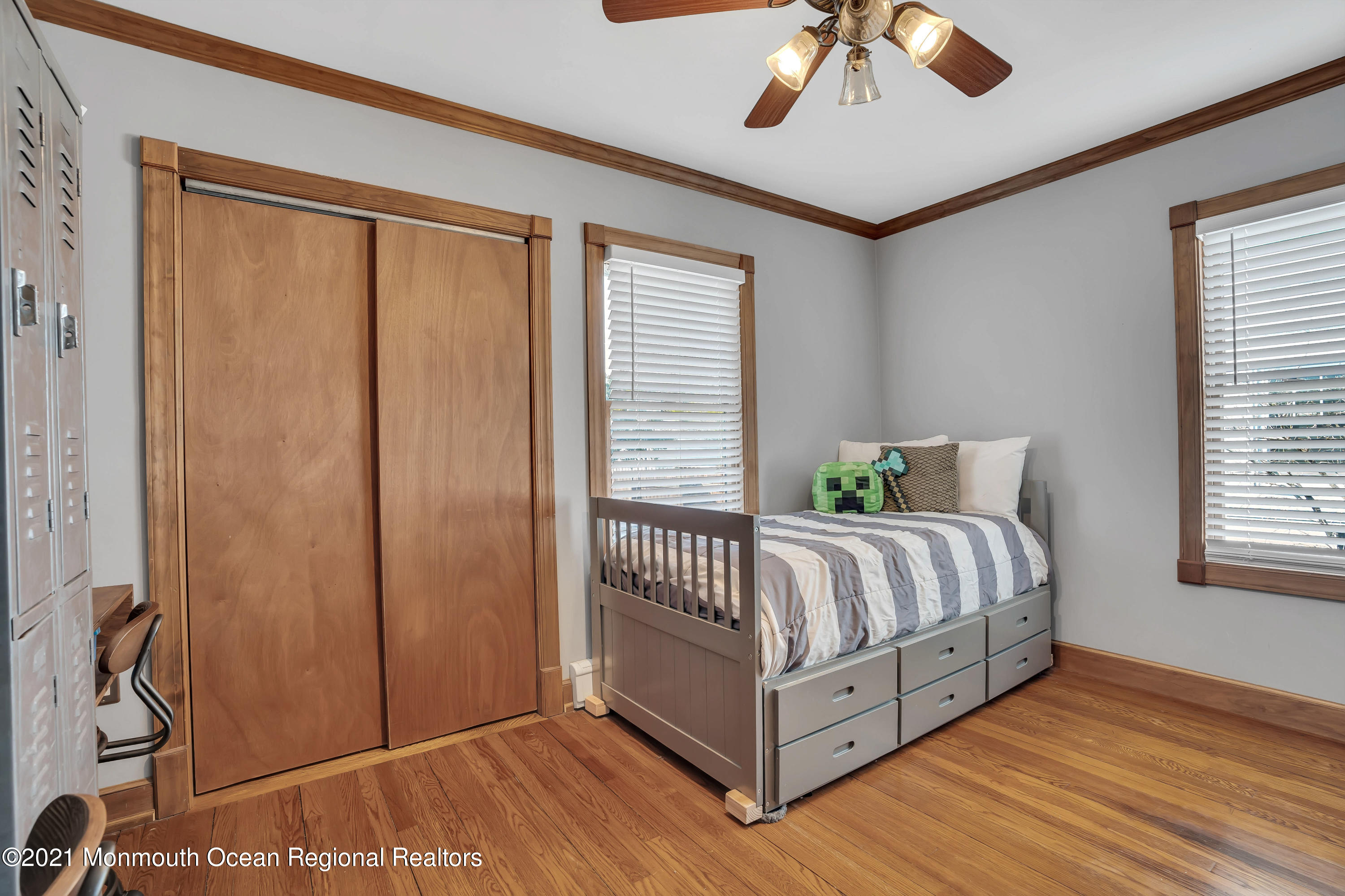 212 Oakhurst Road Oakhurst, NJ 07755 - Photo 18 of 35 a bed sitting in a spacious bedroom next to a window
