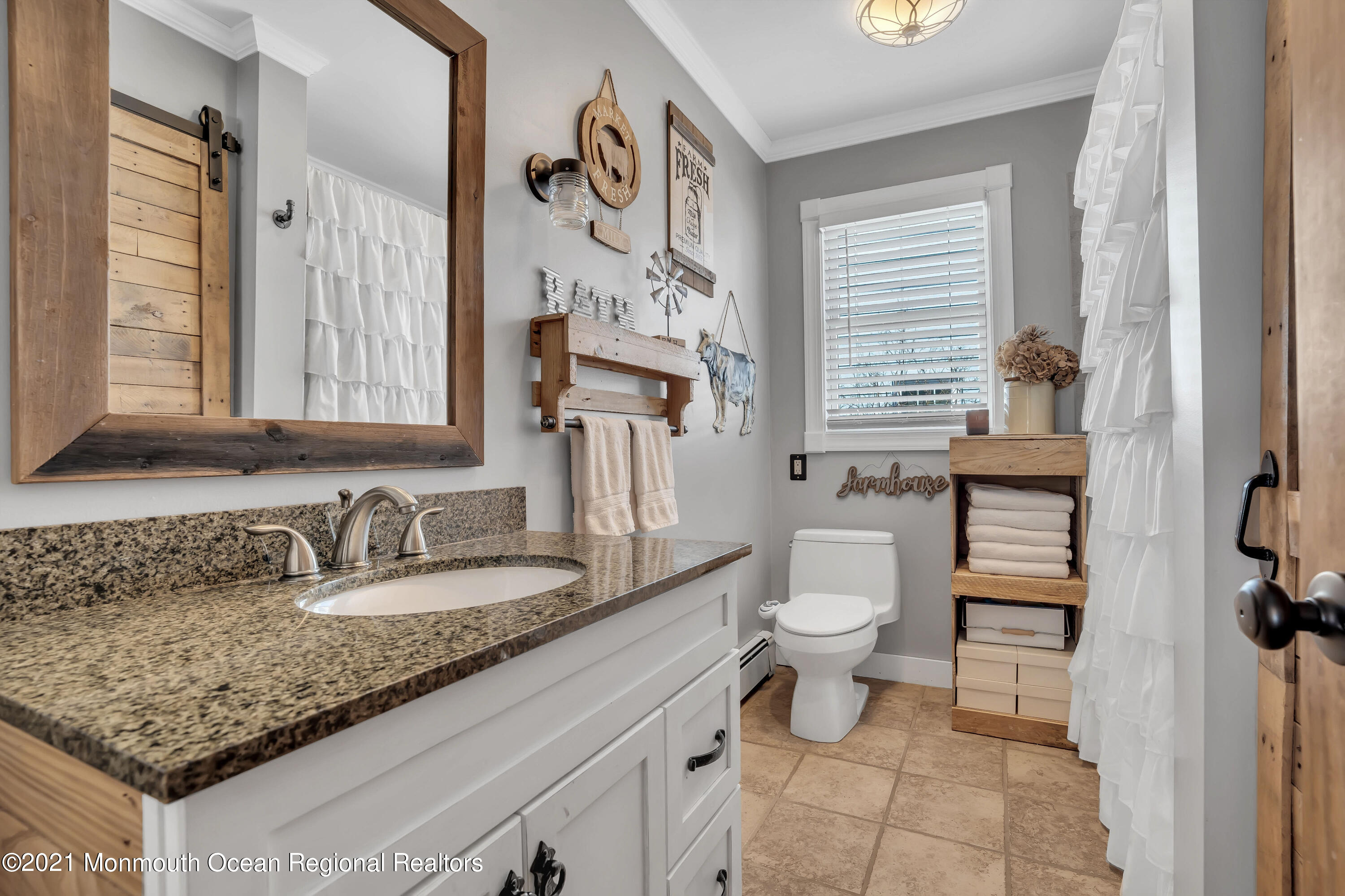 212 Oakhurst Road Oakhurst, NJ 07755 - Photo 20 of 35 a bathroom with a granite countertop sink mirror vanity and toilet