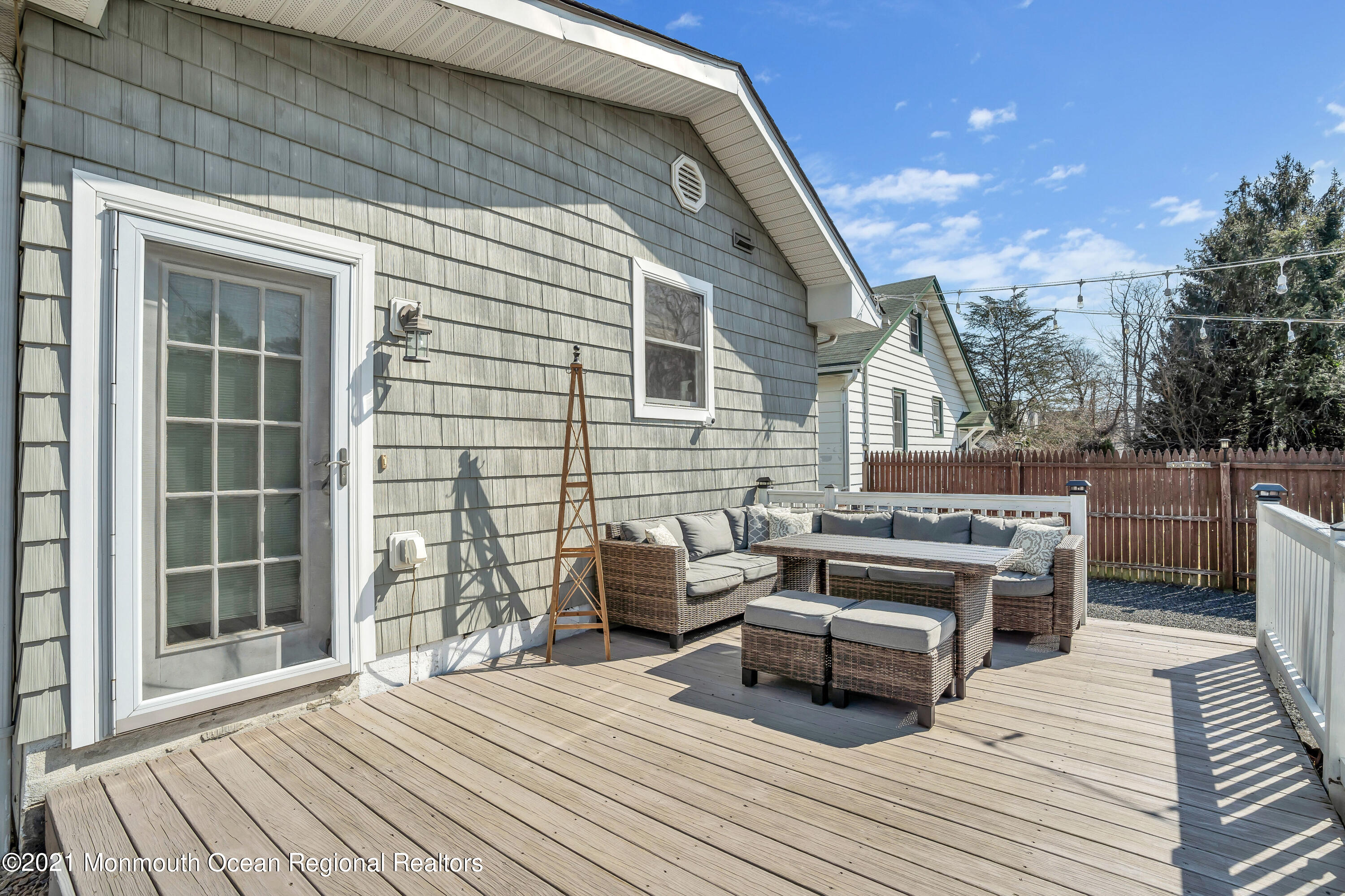 212 Oakhurst Road Oakhurst, NJ 07755 - Photo 29 of 35 a balcony with furniture and wooden floor