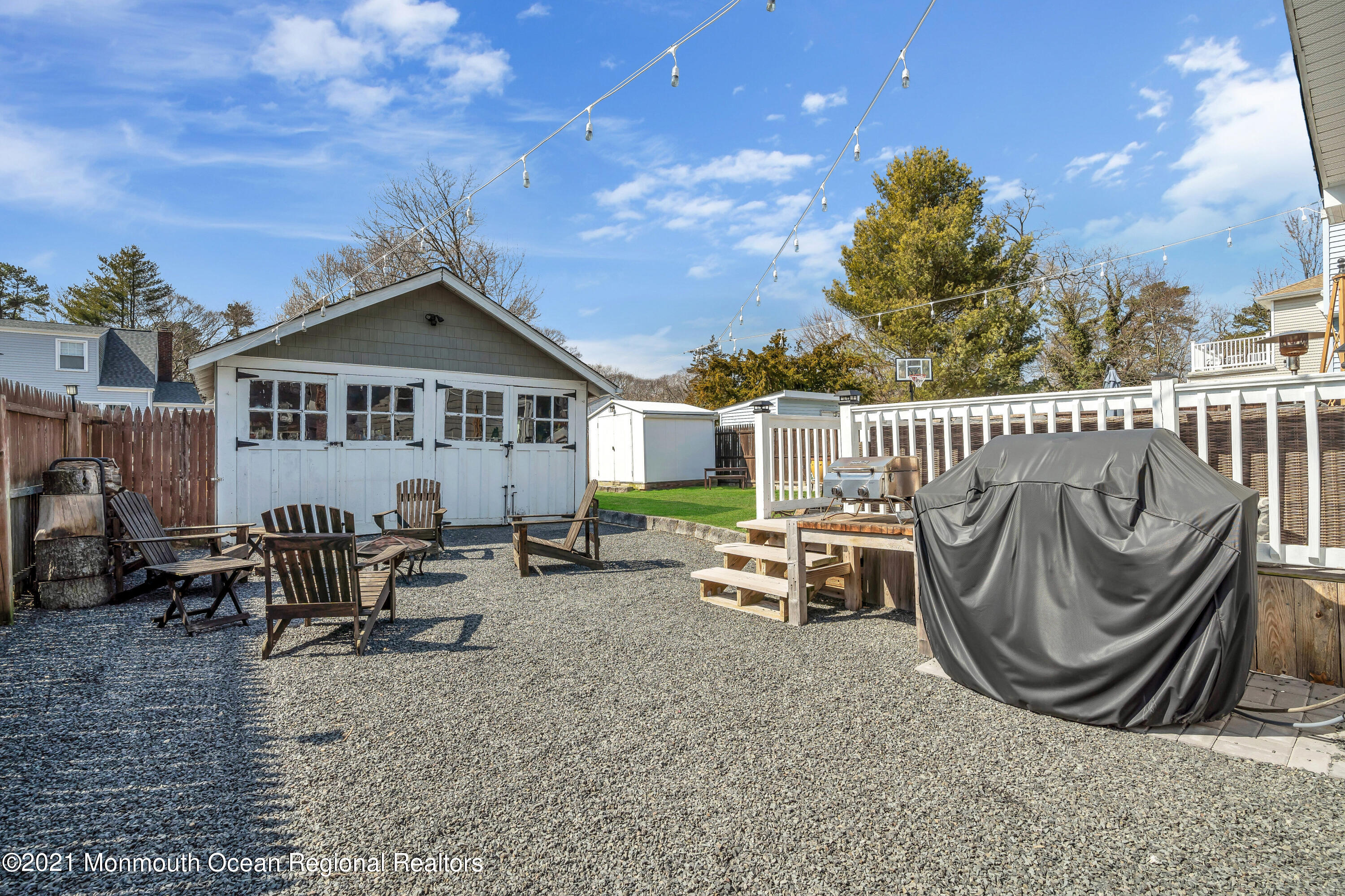 212 Oakhurst Road Oakhurst, NJ 07755 - Photo 33 of 35 a view of a chair and tables in the patio