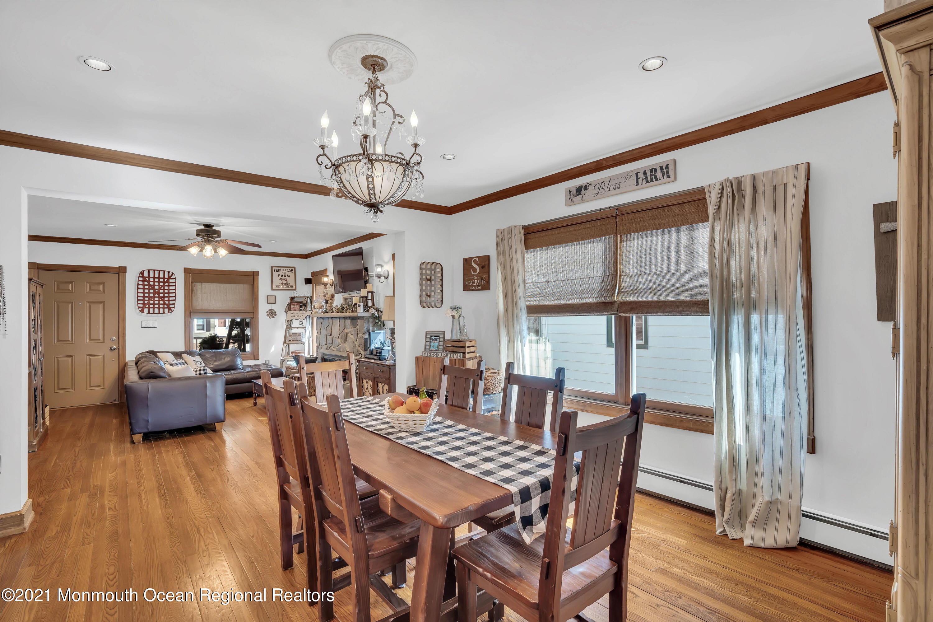 212 Oakhurst Road Oakhurst, NJ 07755 - Photo 8 of 35 a view of a dining room with furniture window and wooden floor