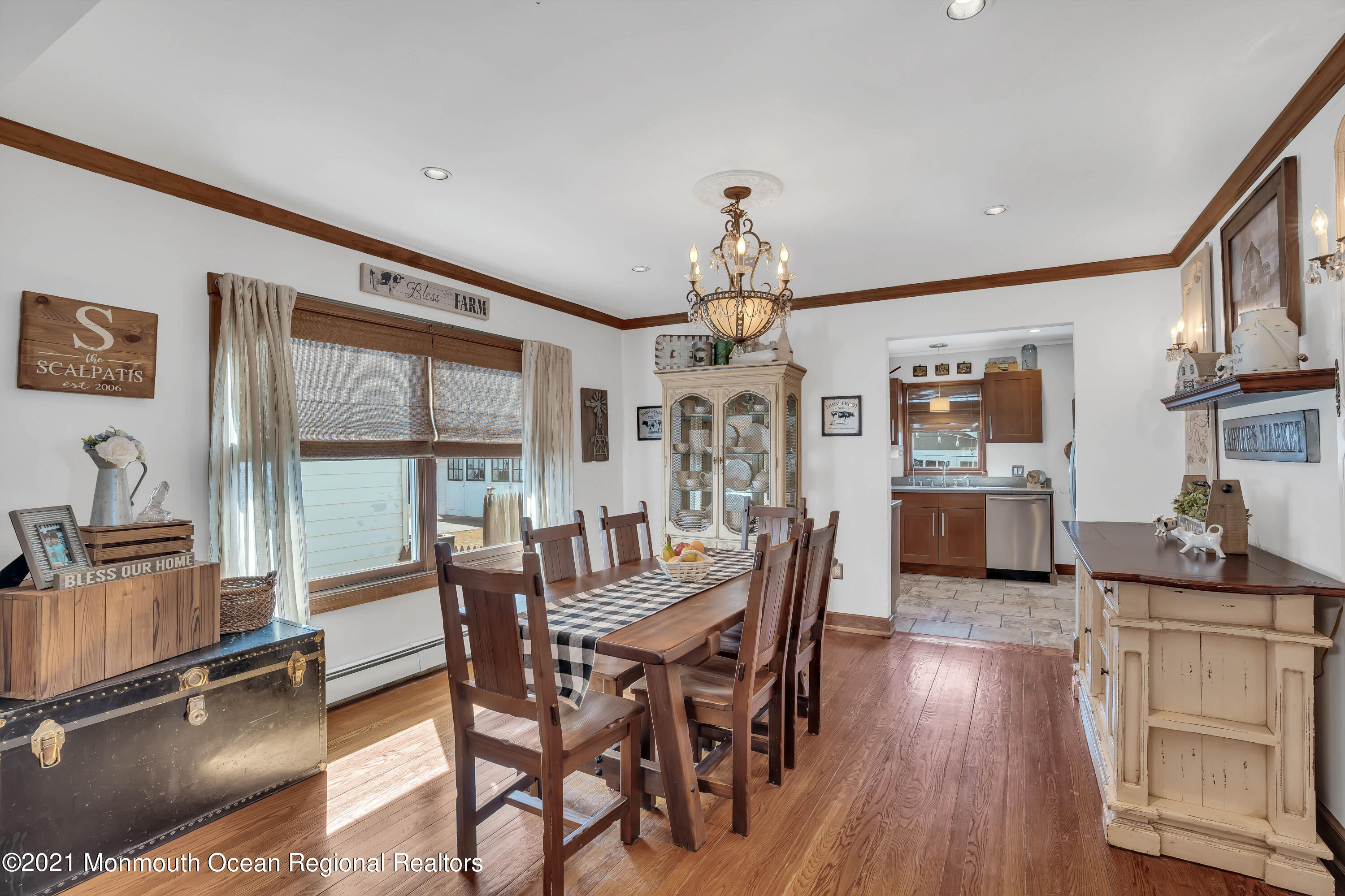 212 Oakhurst Road Oakhurst, NJ 07755 - Photo 9 of 35 a view of a dining room with furniture window and wooden floor