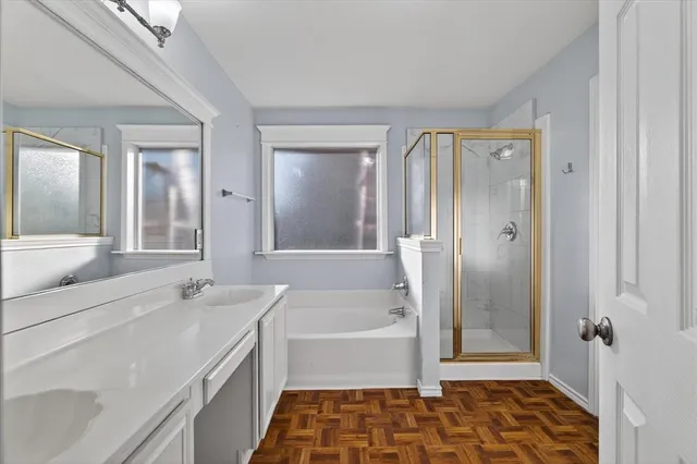 a bathroom with a sink vanity and a mirror