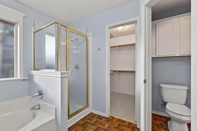 a bedroom with a bed and hallway