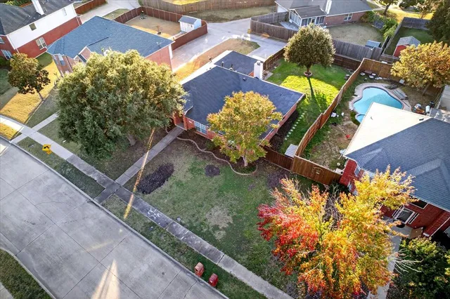an aerial view of a house a yard and outdoor seating