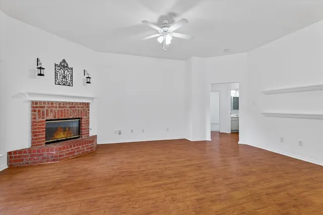 a view of empty room with a fireplace