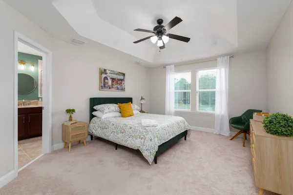a bed room with a bed and a chair