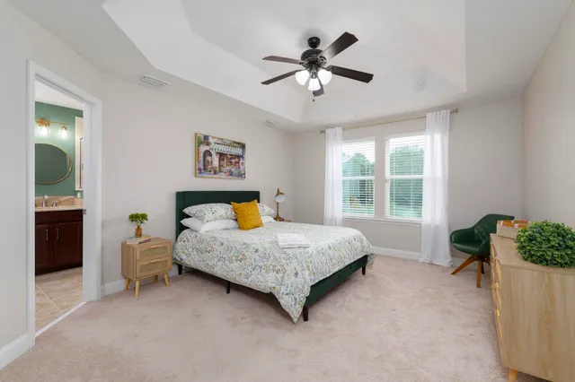 a bed room with a bed and a chair