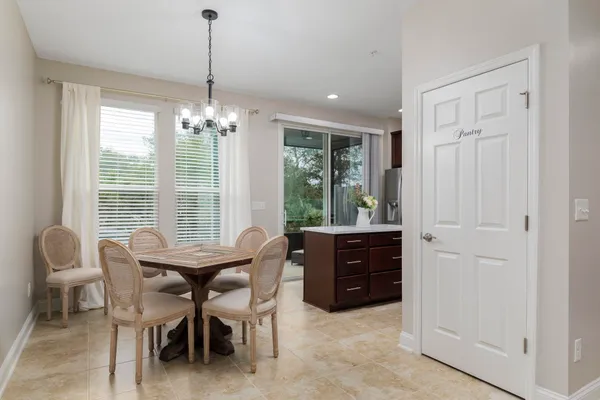a dining room with furniture and window