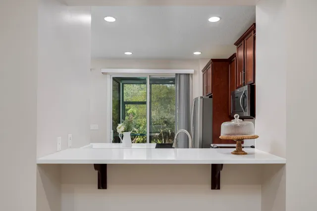 a view of room with a table and chairs