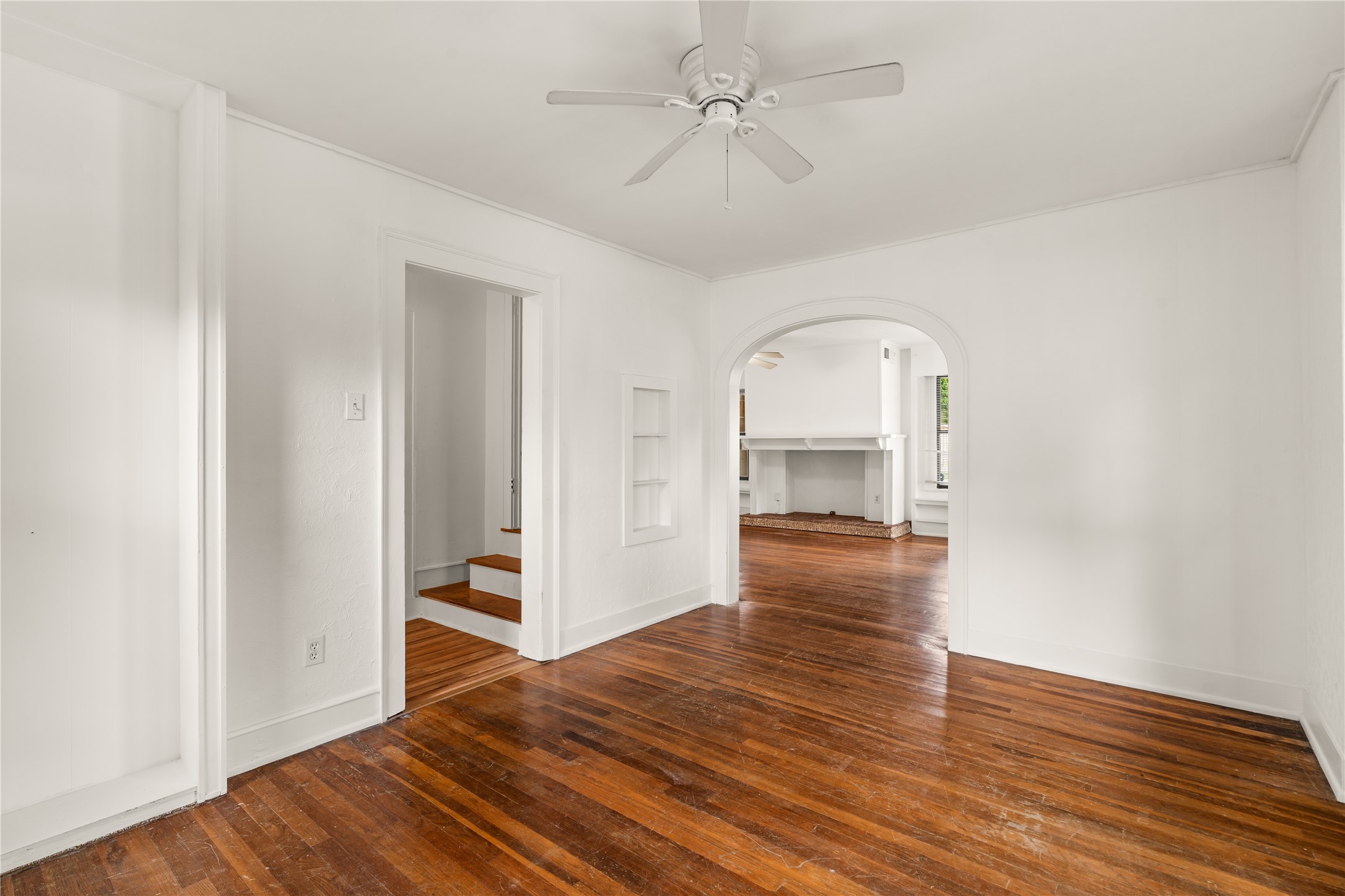 2202 West Main Street Houston, TX 77098 - Photo 8 of 32 a view of empty room with wooden floor and fan
