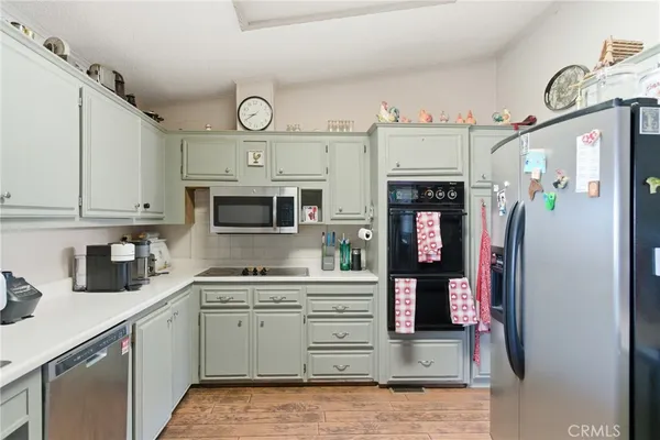 a kitchen with a refrigerator and a sink