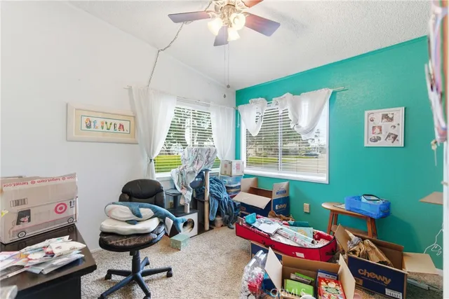 a bathroom with a sink mirror vanity and toilet