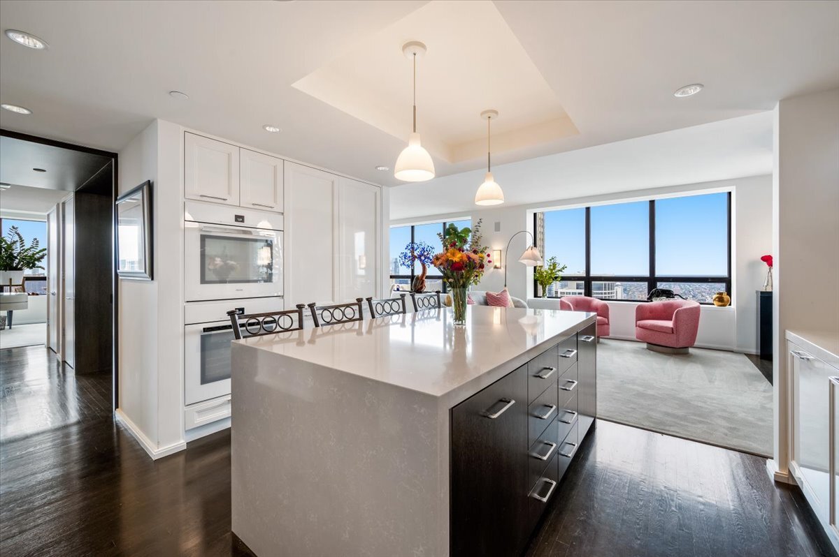 180 East Pearson Street, Unit 5107 Chicago, IL 60611 - Photo 12 of 42 a large kitchen with stainless steel appliances granite countertop a lot of counter space and a sink