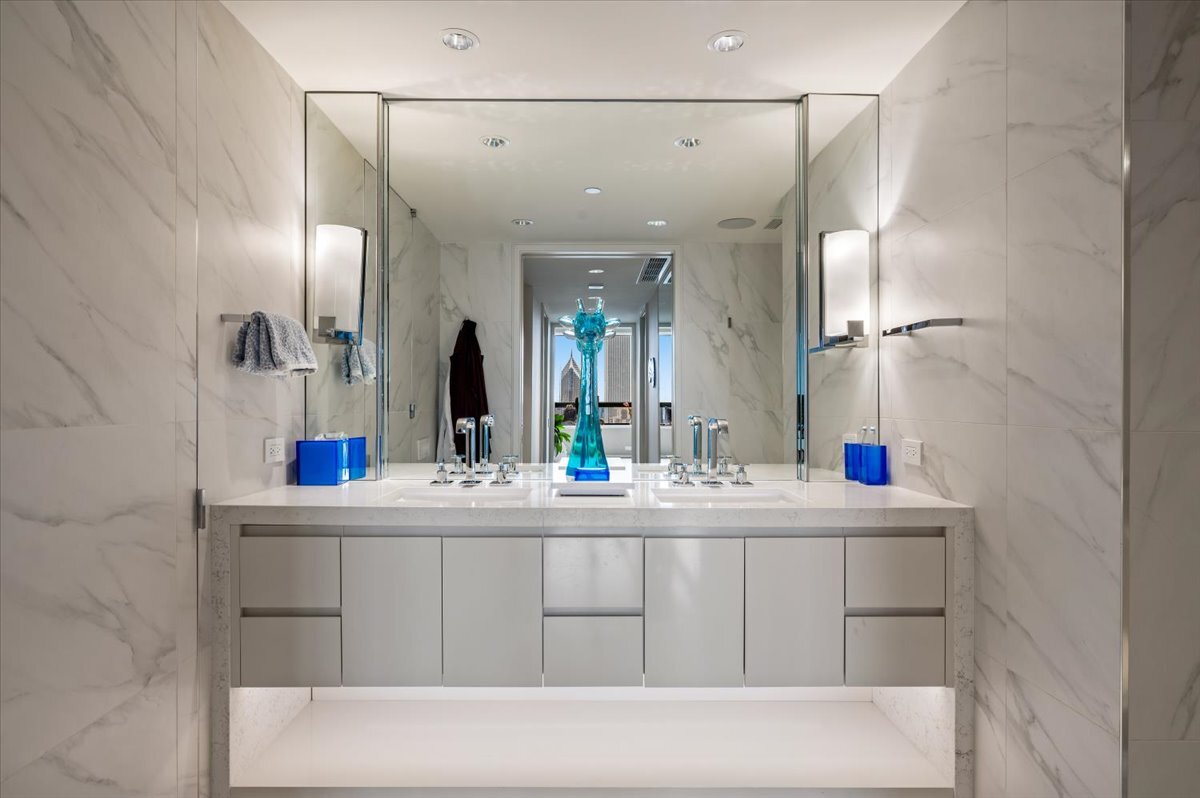180 East Pearson Street, Unit 5107 Chicago, IL 60611 - Photo 21 of 42 a bathroom with a sink and a mirror