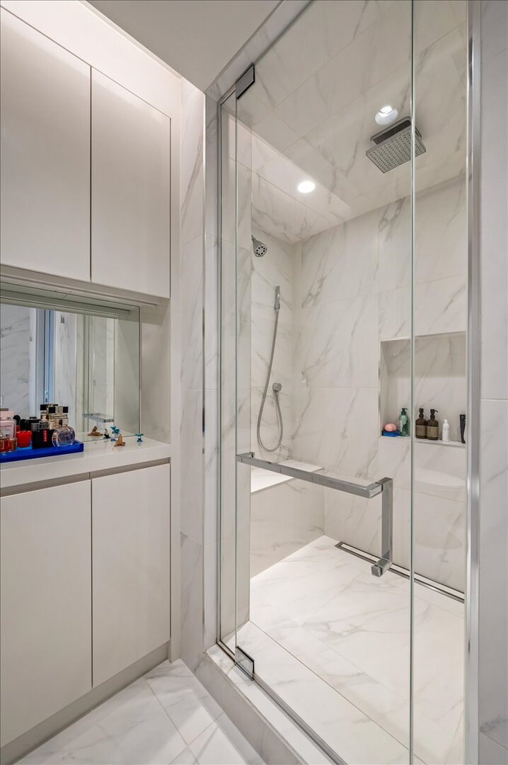 180 East Pearson Street, Unit 5107 Chicago, IL 60611 - Photo 22 of 42 a bathroom with a bathtub and a shower