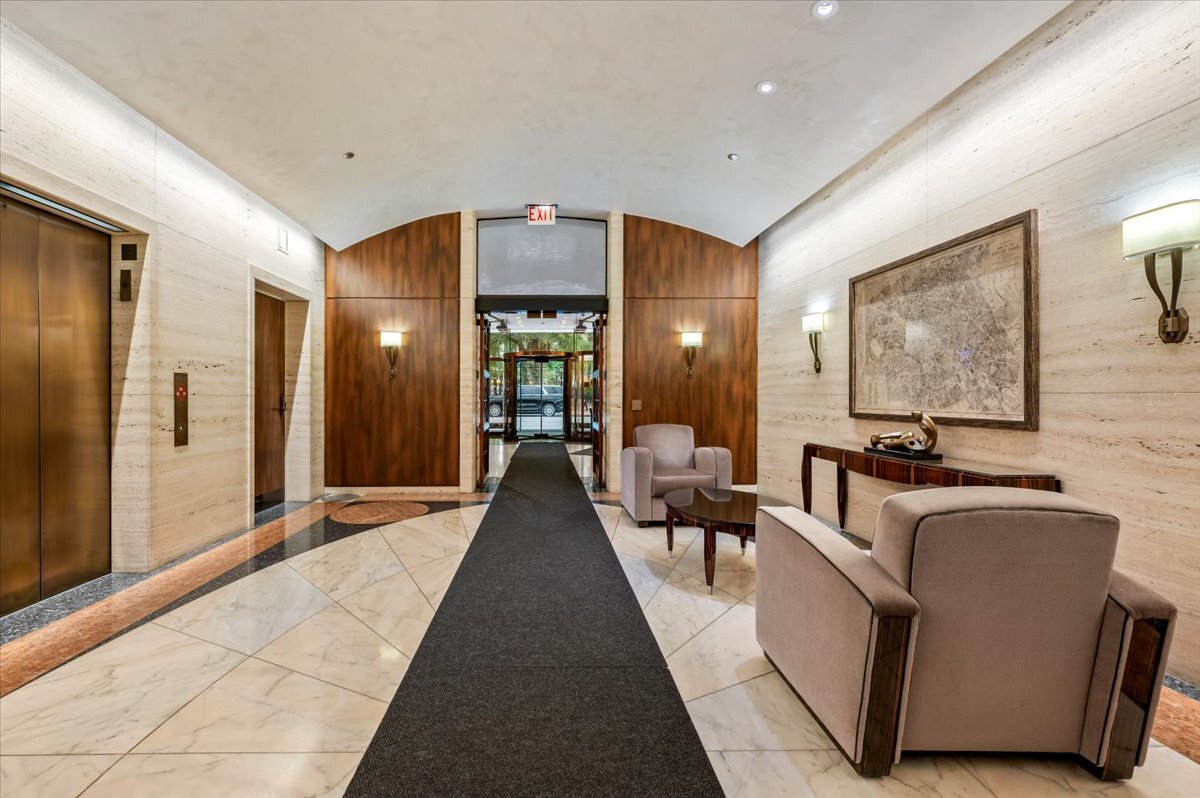 180 East Pearson Street, Unit 5107 Chicago, IL 60611 - Photo 32 of 42 a lobby with furniture and rug