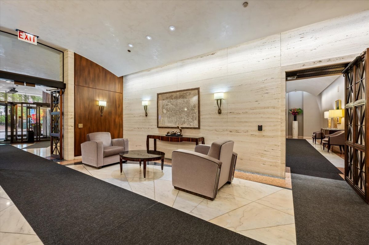 180 East Pearson Street, Unit 5107 Chicago, IL 60611 - Photo 33 of 42 a living room with furniture and a flat screen tv