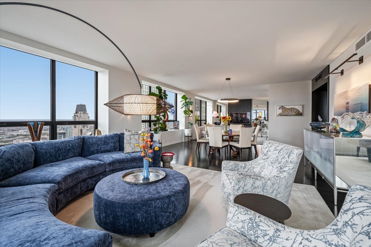 180 East Pearson Street, Unit 5107 Chicago, IL 60611 - Photo 5 of 42 a living room with furniture and a chandelier