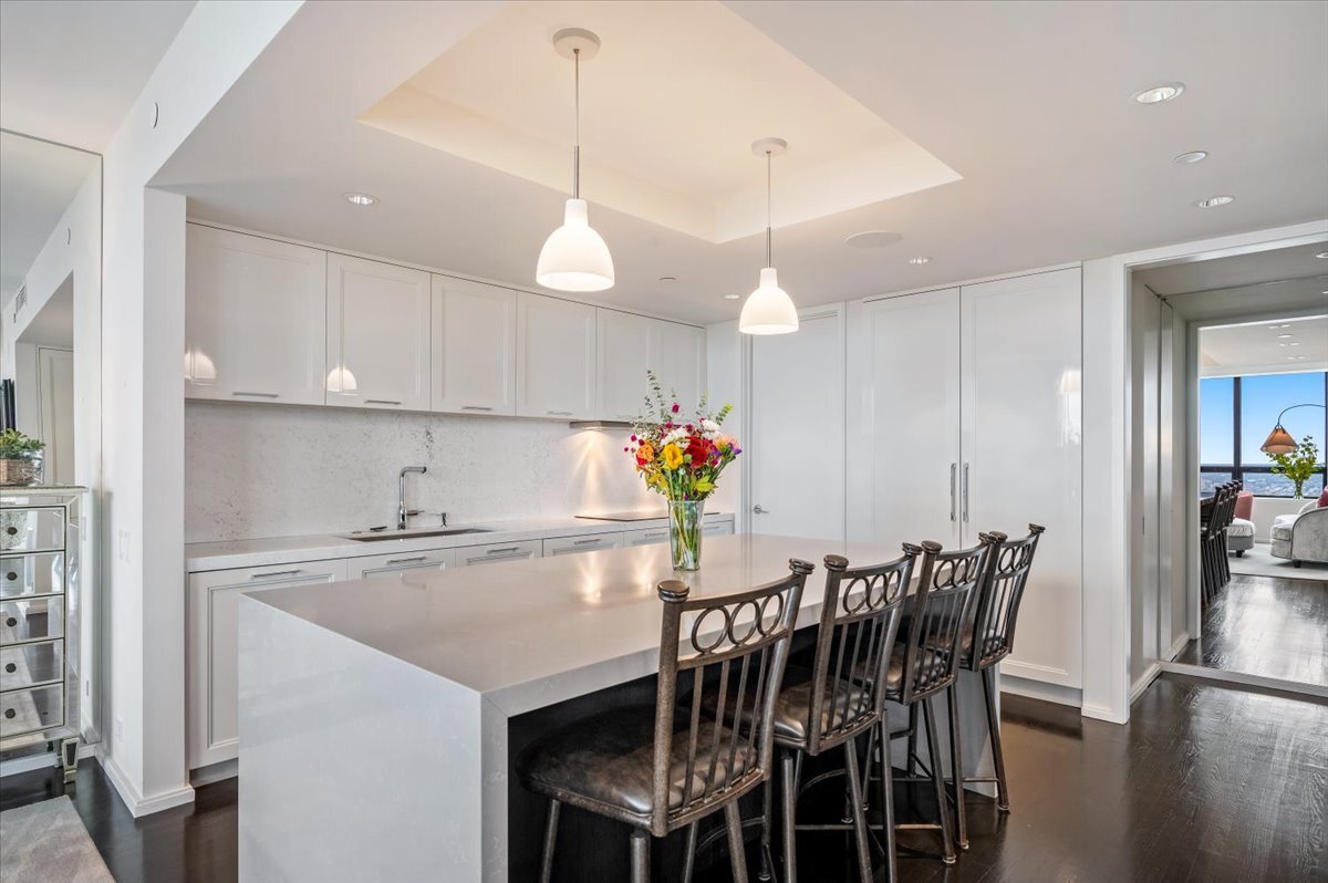 180 East Pearson Street, Unit 5107 Chicago, IL 60611 - Photo 10 of 42 a kitchen with a table and chairs in it