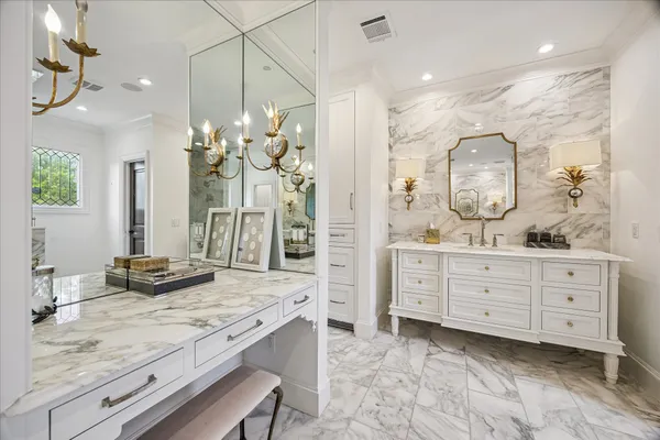a spacious bathroom with a double vanity sink a mirror and a bathtub