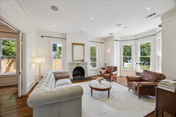 a living room with furniture and a fireplace